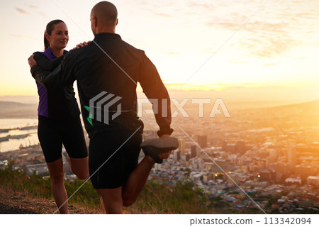 Sunset, stretching and woman with man for fitness, workout coach and help for healthy body. Exercise, wellness and girl runner with personal trainer in muscle warm up for outdoor training in morning. Sunset, stretching and woman with man for fitness, workout coach and help for healthy body. Exercise, wellness and girl runner with personal trainer in muscle warm up for outdoor training in morning. 113342094