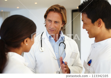 Doctors, mentor and diversity with healthcare for discussion, talking and pen at hospital. Medical professionals, notepad and people with decision in clinic for medicine, results and collaboration Doctors, mentor and diversity with healthcare for discussion, talking and pen at hospital. Medical professionals, notepad and people with decision in clinic for medicine, results and collaboration 113342105