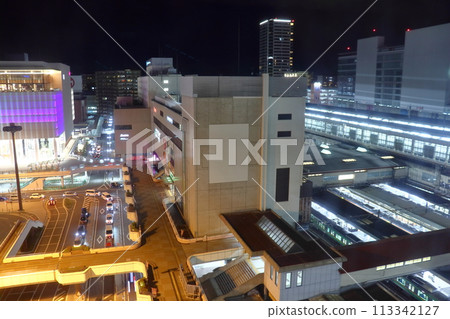 The pedestrian deck in front of the west exit of Gunma Station, the station building, and the station premises at night 113342127