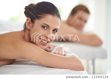 Happy, couple and portrait on table in spa to relax with luxury treatment for wellness on holiday or vacation. Beauty, care and people together in hotel or resort for healthy facial or skincare 113342134