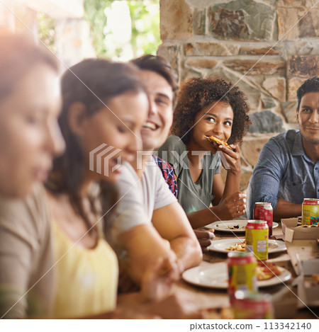 Friends, woman and eating of pizza in home with happiness, soda and social gathering for bonding in dining room. Men, group and fast food with smile, drinks and diversity at table in lounge of house 113342140