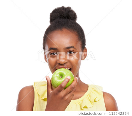 Eating, wellness and portrait of girl and apple in studio for nutrition, health and diet. Food, self care and vitamin c with face of African teenage child and fruit on white background with a smile 113342254