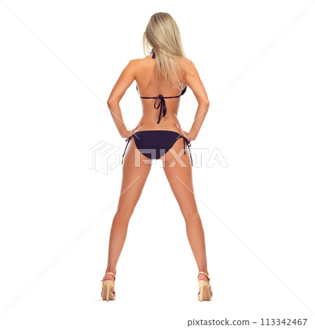 Confident, woman and back of bikini with fashion, style or legs in high heels on mockup space. Swimwear, model and butt in underwear in white background of studio with pride for vacation or holiday 113342467
