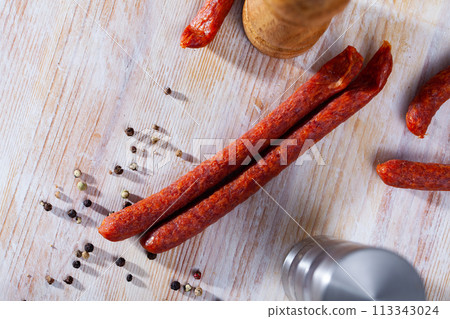 Appetizing smoked sausages for snacks 113343024