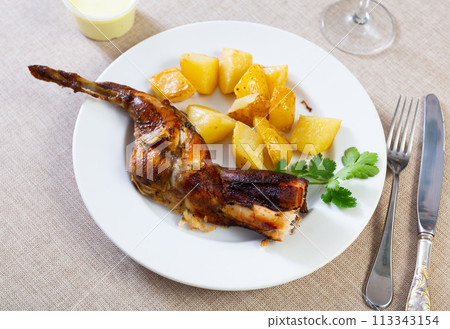 Appetizing stew with rabbit pieces and potatoes. Healthy hearty dinner 113343154