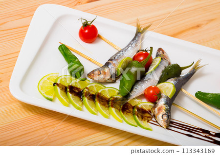 Broiled anchovies on skewers Broiled anchovies on skewers 113343169
