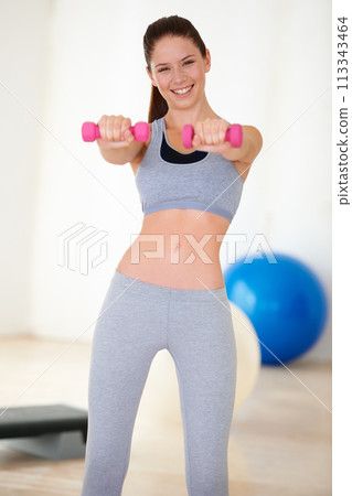 Woman, flexibility or portrait for dumbbells in studio, health wellness or fitness for weight loss with exercise. Young person, happy or face with hand weights for tone muscle or supple body in gym Woman, flexibility or portrait for dumbbells in studio, health wellness or fitness for weight loss with exercise. Young person, happy or face with hand weights for tone muscle or supple body in gym 113343464