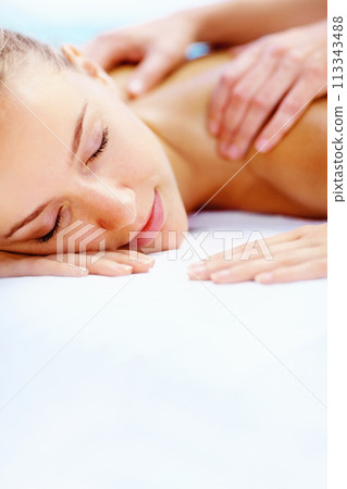 Spa, massage and health with woman, luxury resort and holiday with body care, treatment and relax. Person, happy and girl on a weekend break, calm and wellness with peace, stress relief and zen 113343488