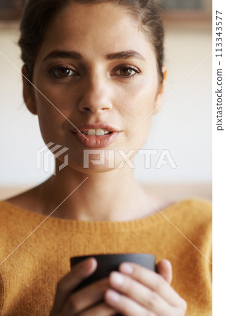 Portrait, woman and drinking coffee in home to relax, peace or calm for energy at breakfast in the morning. Face, tea cup and young female person with latte, espresso or hot beverage in apartment Portrait, woman and drinking coffee in home to relax, peace or calm for energy at breakfast in the morning. Face, tea cup and young female person with latte, espresso or hot beverage in apartment 113343577
