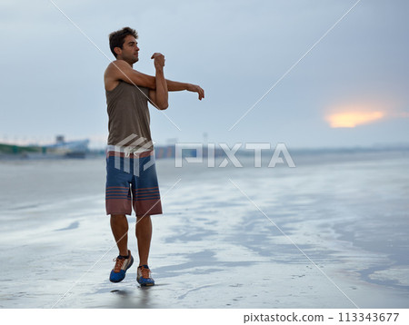 Holiday, stretching and beach with man, fitness and vacation with summer break and morning. Person, ocean and guy with wellness or seaside with with exercise, peaceful and water with health or travel 113343677