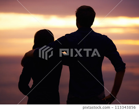 Back, sunset and couple hug with silhouette, view outdoor with nature and travel together for love and bonding. Adventure, journey and people in environment, orange sky with support and trust Back, sunset and couple hug with silhouette, view outdoor with nature and travel together for love and bonding. Adventure, journey and people in environment, orange sky with support and trust 113343856