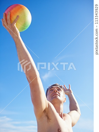 Beach, volleyball and man with fitness, holiday and sunshine with player and workout for wellness. Person, athlete and guy with summer and seaside with training and practice for health and vacation 113343929