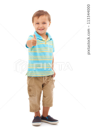 Boy child, thumbs up and studio portrait with smile, choice and vote for agreement by white background. Kid, model or person in trendy fashion with sign, symbol and icon for yes, thank you or like Boy child, thumbs up and studio portrait with smile, choice and vote for agreement by white background. Kid, model or person in trendy fashion with sign, symbol and icon for yes, thank you or like 113344000