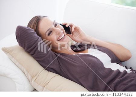 Woman, laugh and relax on sofa for phone call, communication and mobile networking at home. Happy lady, smartphone and audio contact for funny conversation, gossip and digital connection in lounge Woman, laugh and relax on sofa for phone call, communication and mobile networking at home. Happy lady, smartphone and audio contact for funny conversation, gossip and digital connection in lounge 113344152