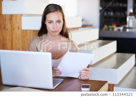 Woman, research and home with paperwork or laptop in table for remote work as journalist. Portrait, female person and concentration in living room or lounge to browse internet for information. Woman, research and home with paperwork or laptop in table for remote work as journalist. Portrait, female person and concentration in living room or lounge to browse internet for information. 113344321