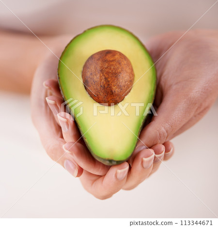 Hands, avocado and vegetable diet for nutrition, health and minerals or vitamins for wellness. Closeup, person and holding vegan food for green detox, superfoods and omega 3 for organic skincare Hands, avocado and vegetable diet for nutrition, health and minerals or vitamins for wellness. Closeup, person and holding vegan food for green detox, superfoods and omega 3 for organic skincare 113344671