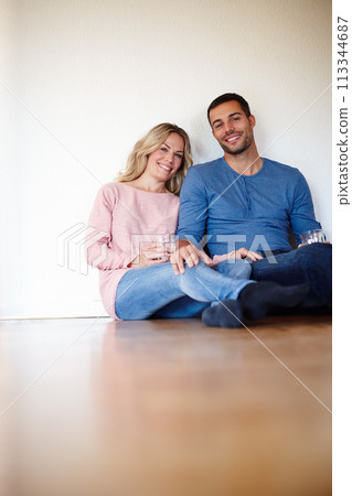 Happy couple, portrait and sitting on living room floor in new house for memories, drinks and home renovation. Dreaming, apartment and decision for decoration, interior design and future planning. 113344687
