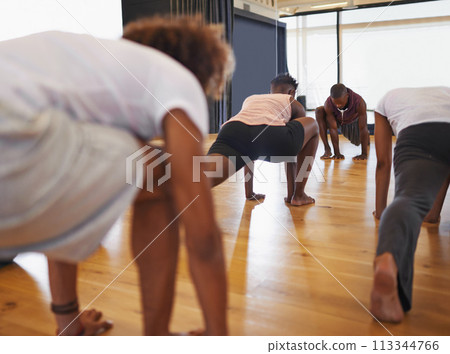 Dance, class and people stretching legs on floor to start rehearsal together in studio or academy. Training, body and healthy exercise for fitness in creative school with yoga or pilates workout Dance, class and people stretching legs on floor to start rehearsal together in studio or academy. Training, body and healthy exercise for fitness in creative school with yoga or pilates workout 113344766