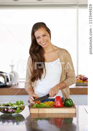 Woman, kitchen and vegetables for nutrition in portrait, diet and food preparation for cooking. Female person, home and fresh produce for salad or vegan dinner, organic ingredients and cutting green 113344929