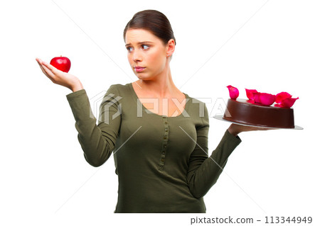 Woman, apple and cake for choice in studio with options, thinking and ideas for diet by white background. Girl, person and model with dessert, fruit and decision for health, wellness and nutrition Woman, apple and cake for choice in studio with options, thinking and ideas for diet by white background. Girl, person and model with dessert, fruit and decision for health, wellness and nutrition 113344949