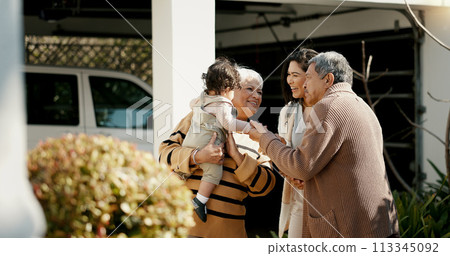 Family, welcome and hug outdoor of home in backyard with mother, grandparents and child with love and care. Reunion, woman and kid visit parents, travel and surprise for holiday with embrace or joy 113345092
