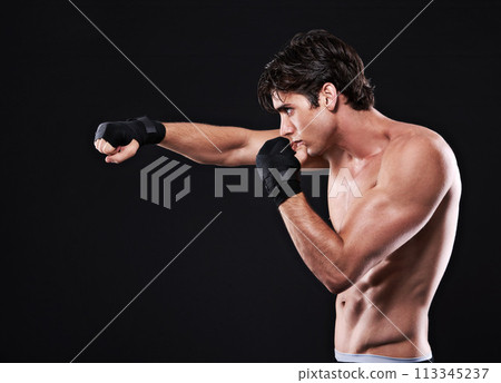 Fitness, mma and man punching in studio for exercise, challenge or competition training for boxing. Power, muscle or profile of champion boxer at workout with confidence, fight and black background Fitness, mma and man punching in studio for exercise, challenge or competition training for boxing. Power, muscle or profile of champion boxer at workout with confidence, fight and black background 113345237