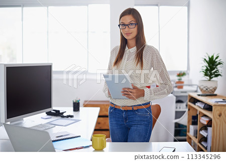 Professional, portrait and woman with tablet at desk in office or creative web developer. Website, designer or person with research on internet for development of company erp, software and site Professional, portrait and woman with tablet at desk in office or creative web developer. Website, designer or person with research on internet for development of company erp, software and site 113345296