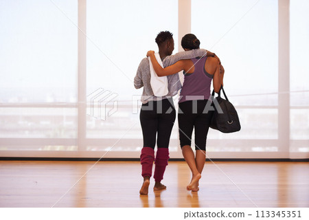 Fitness, hug and back of friends at gym walking after training, exercise or sports routine. Workout, club and women with support after morning cardio routine, challenge or bonding with conversation 113345351