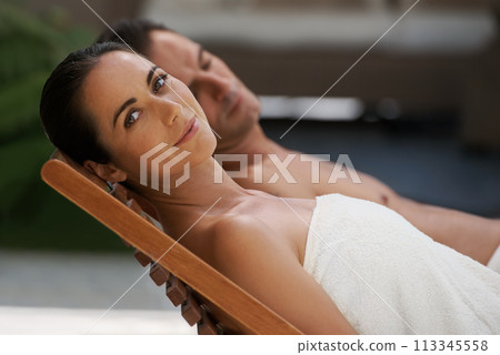 Portrait, relax and couple at hotel pool with smile, sleep and holiday together at wellness spa getaway. Hospitality, happy woman and man at luxury villa for travel, vacation or love on romantic date 113345558