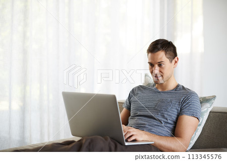 Relax, remote work and man on sofa with laptop for working from home, freelance job and career. Business, startup and person on computer for typing email, planning or internet research on website Relax, remote work and man on sofa with laptop for working from home, freelance job and career. Business, startup and person on computer for typing email, planning or internet research on website 113345576