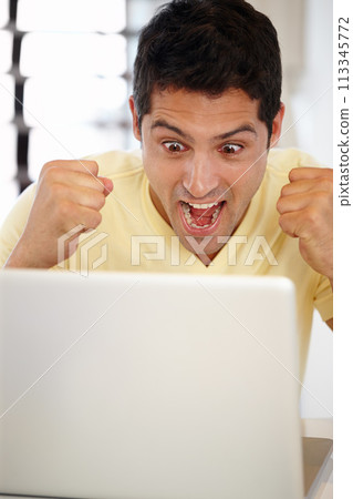 Man, excited and laptop in office for internet, research online and website for company. Young person, editor and happy with tech for typing, email and creative project for work, job and success 113345772