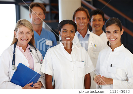 Doctors, group and portrait with smile in hospital with diversity, medicine and colleagues for healthcare. Men, women and happy in team with medical staff for solidarity, pride and wellness in clinic Doctors, group and portrait with smile in hospital with diversity, medicine and colleagues for healthcare. Men, women and happy in team with medical staff for solidarity, pride and wellness in clinic 113345923