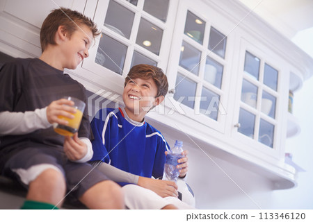 Kitchen, team and boys with smile for drinks, soccer or football and practice for match with ball. Friends, children and kids ready in house for workout, exercise and training to play sport for game 113346120