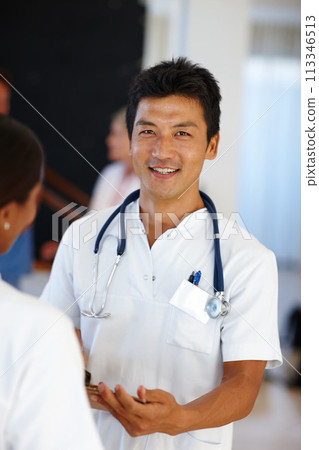 Asian doctor, portrait and discussion with report, results and paperwork for health and wellness. Cardiologist, stethoscope and medical chart for healthcare, insurance and professional diagnosis 113346513