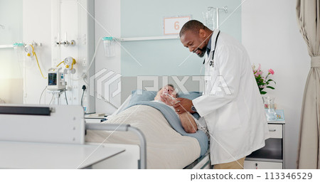 Consultation, healthcare and doctor with patient in hospital after surgery, treatment or procedure. Discussion, checkup and African male medical worker talk to senior man in clinic bed for diagnosis. Consultation, healthcare and doctor with patient in hospital after surgery, treatment or procedure. Discussion, checkup and African male medical worker talk to senior man in clinic bed for diagnosis. 113346529