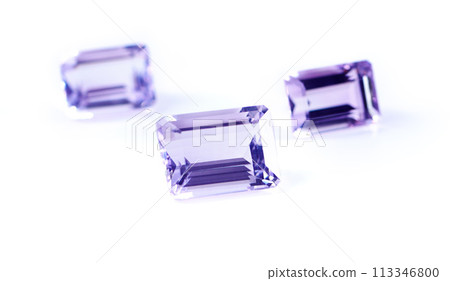 Gemstone, jewel and amethyst in studio with isolated white background for natural resource, baguette and sparkle for luxury. Rock, purple crystal and reflection in closeup for shine, glow and mineral 113346800