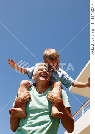 Kid, happy and on grandpa shoulder for bonding, family game or development at home flying. Parent, smiling and grandchild excited sitting on senior for summer entertainment, amusement or retirement 113346829
