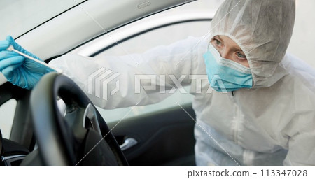 Science, csi and swab for dna evidence in crime scene car for investigation of accident and burglary with hazmat..Forensic, research analysis and person with sample collection for medical observation 113347028