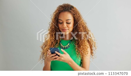 Excited woman, phone and winning with good news, promotion or lottery on a gray studio background. Happy female person with smile, fist pump or mobile smartphone for celebration or success on mockup 113347070