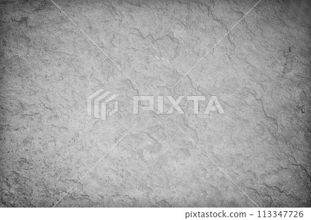 Dark grey slate rough stone wall background or texture. 113347726
