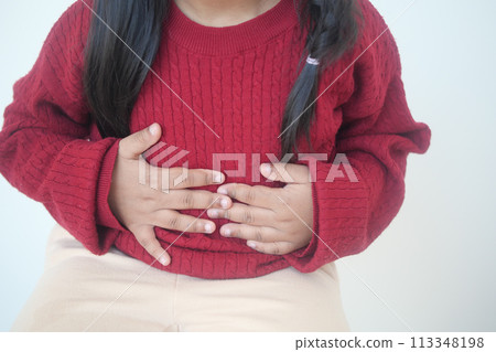 child suffering stomach pain close up. 113348198