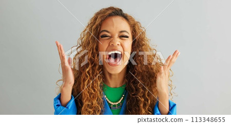 Excited woman, fist pump and celebration with deal, promotion or winning on a gray studio background. Portrait of happy female person or young winner with smile in surprise for bonus on mockup space 113348655