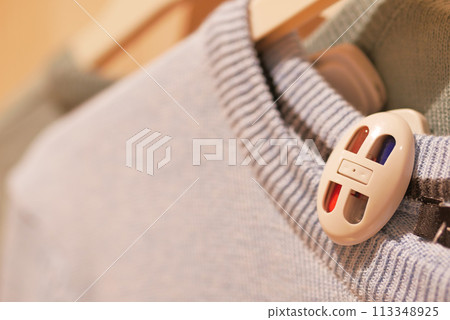 Clothing security tag on a shirt , 113348925