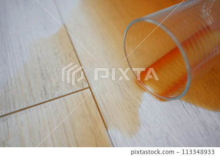 cup of coffee spilled on wooden floor cup of coffee spilled on wooden floor 113348933