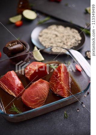 pieces of tuna fillet in a soy sauce marinade and sesame seeds pieces of tuna fillet in a soy sauce marinade and sesame seeds 113349499