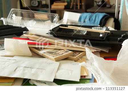 Cash and bankbook found among piles of documents and mail; secret savings; sorting belongings; messy room Cash and bankbook found among piles of documents and mail; secret savings; sorting belongings; messy room 113351127