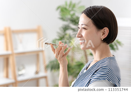 woman making speaker call woman making speaker call 113351744
