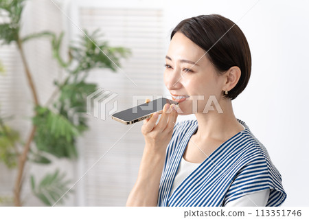 woman making speaker call woman making speaker call 113351746