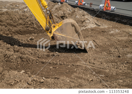 Heavy machinery digging the ground during civil engineering work 113353248