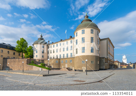 Wrangel Palace, the distinguished seat of the Svea Court of Appeal, basks in the sunlight, showcasing its grand architecture against a clear blue sky on Riddarholmen, Stockholm, Sweden Wrangel Palace, the distinguished seat of the Svea Court of Appeal, basks in the sunlight, showcasing its grand architecture against a clear blue sky on Riddarholmen, Stockholm, Sweden 113354011
